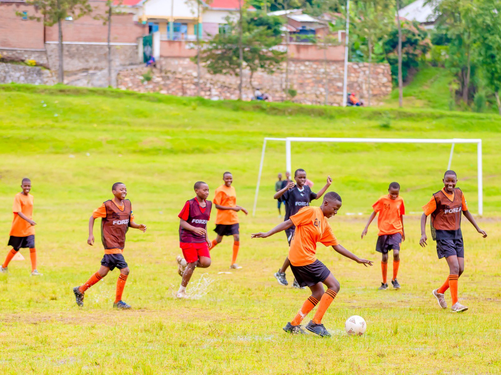 International volunteers training with young players
